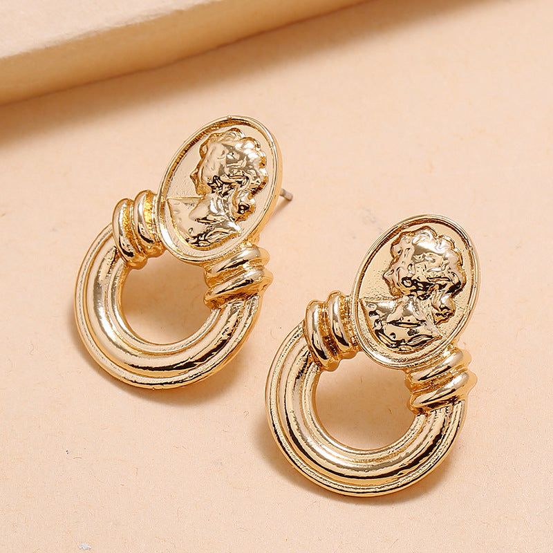 Gold Tone Embossed Silhouette Earrings