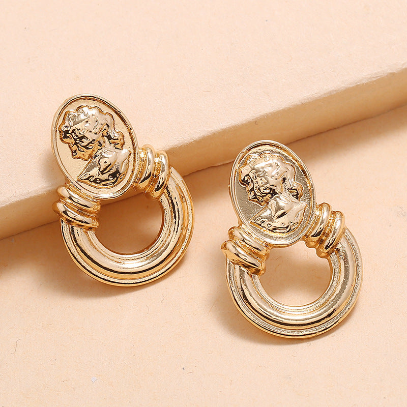 Gold Tone Embossed Silhouette Earrings