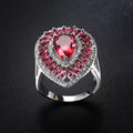 Cushioned Ruby Teardrop Domineering Ring